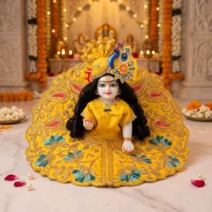 Yellow heavy zari embroidery Laddu Gopal dress with gold paisley work, teal flower hem and matching peacock pagdi